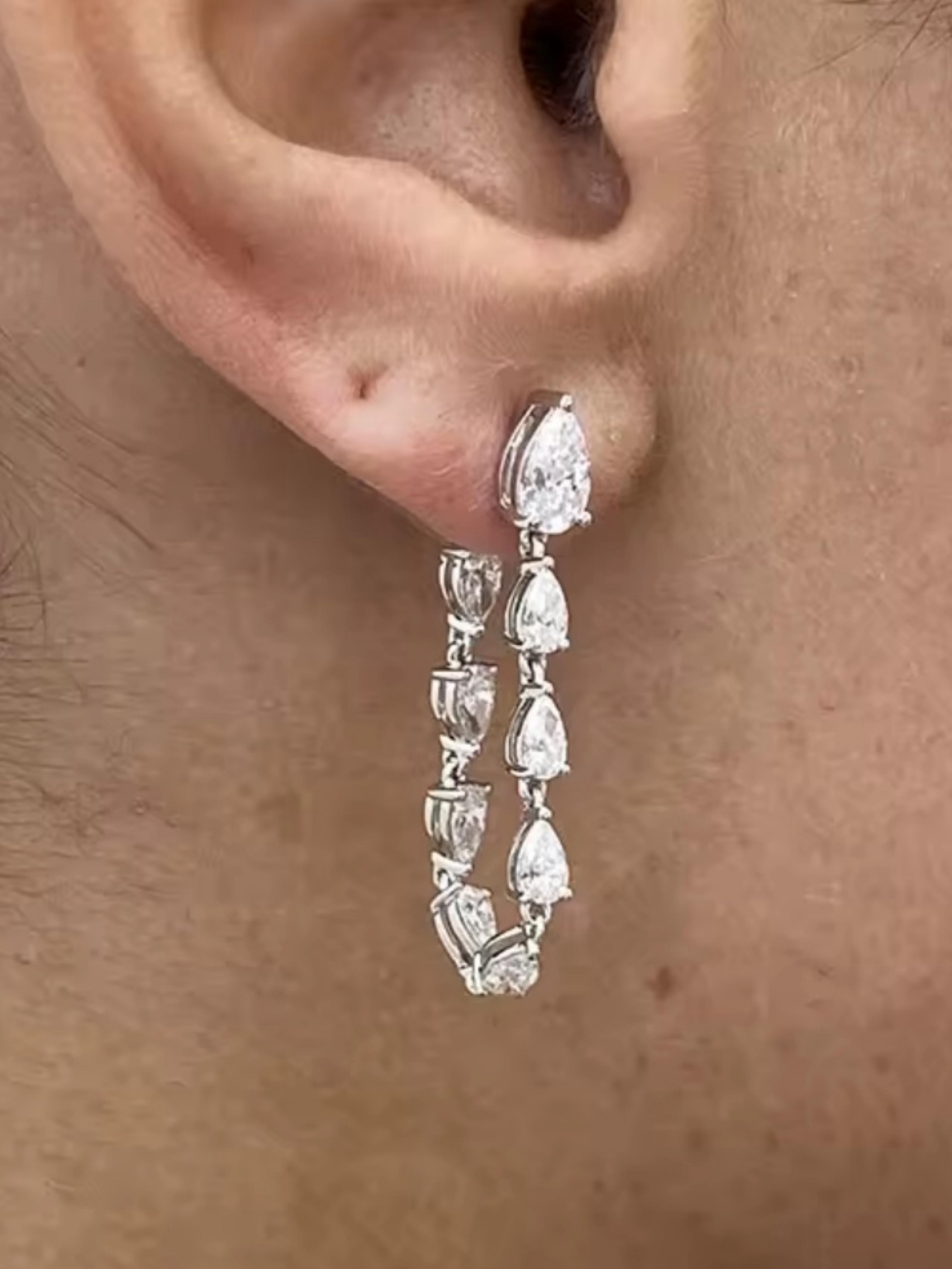 Independent designer Diamond statement loop earrings available to rent