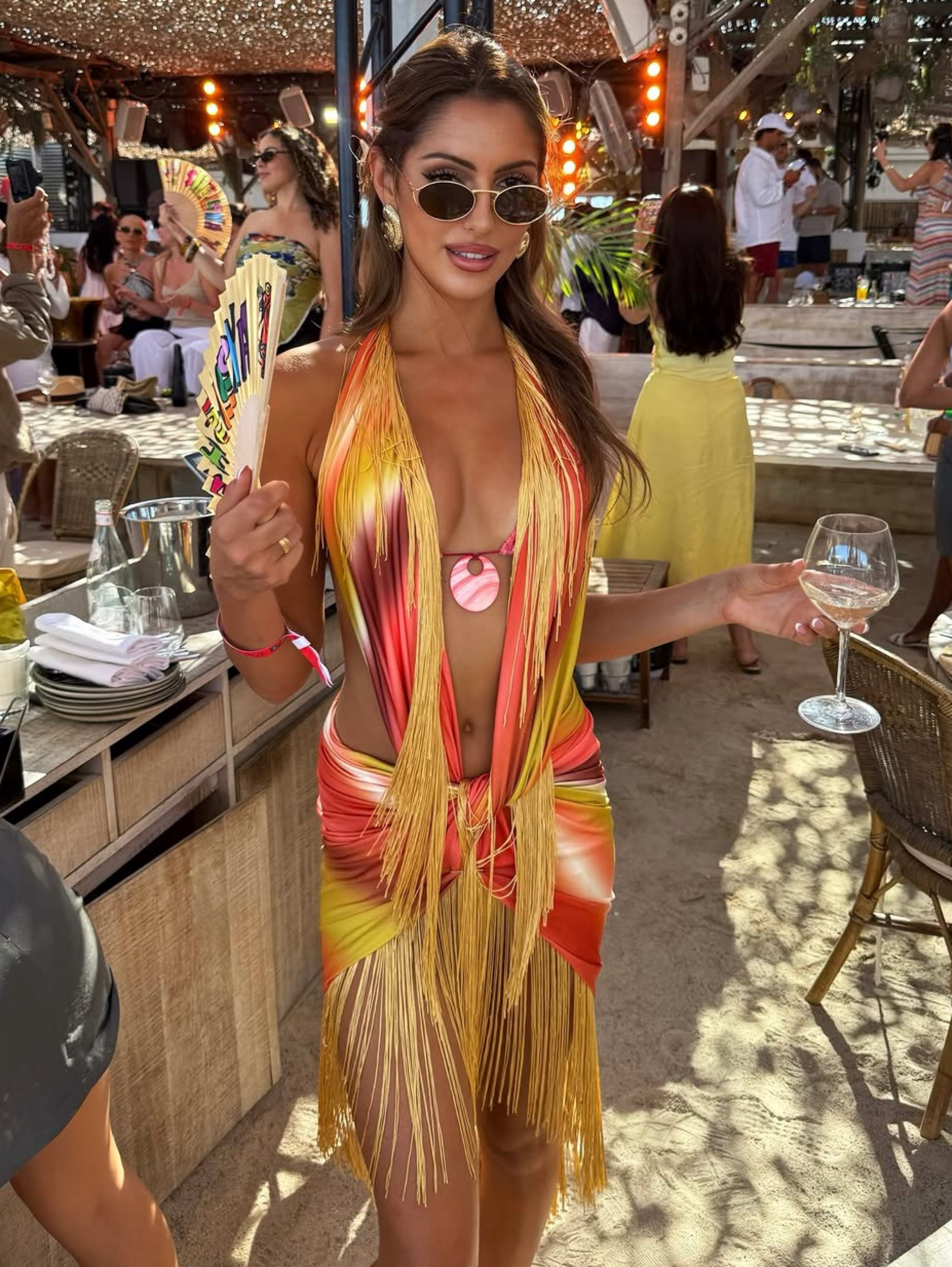 Independent designer Orange sunset fringe dress shellona available to rent