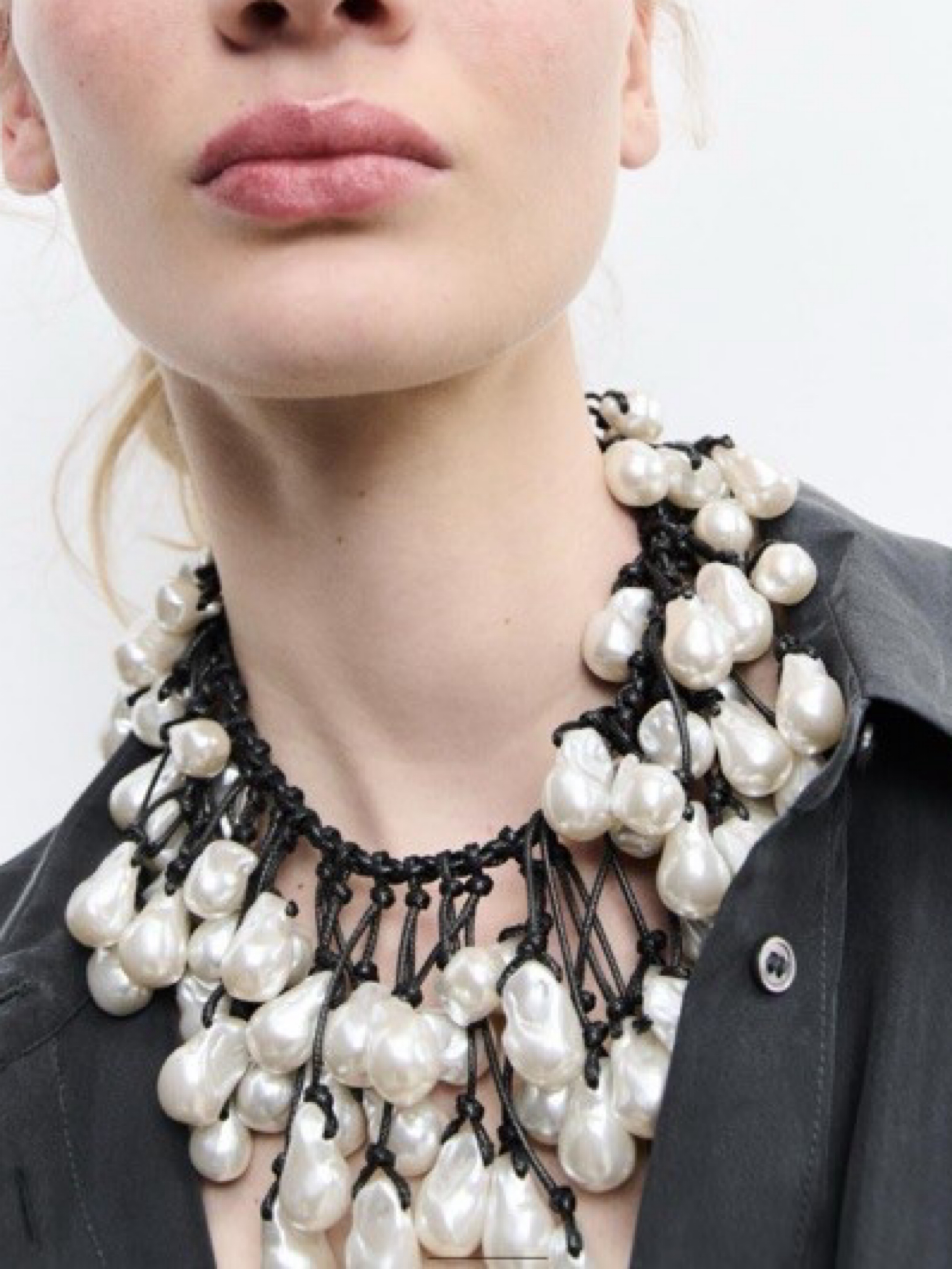 Independent designer Zara shell fringe necklace available to rent