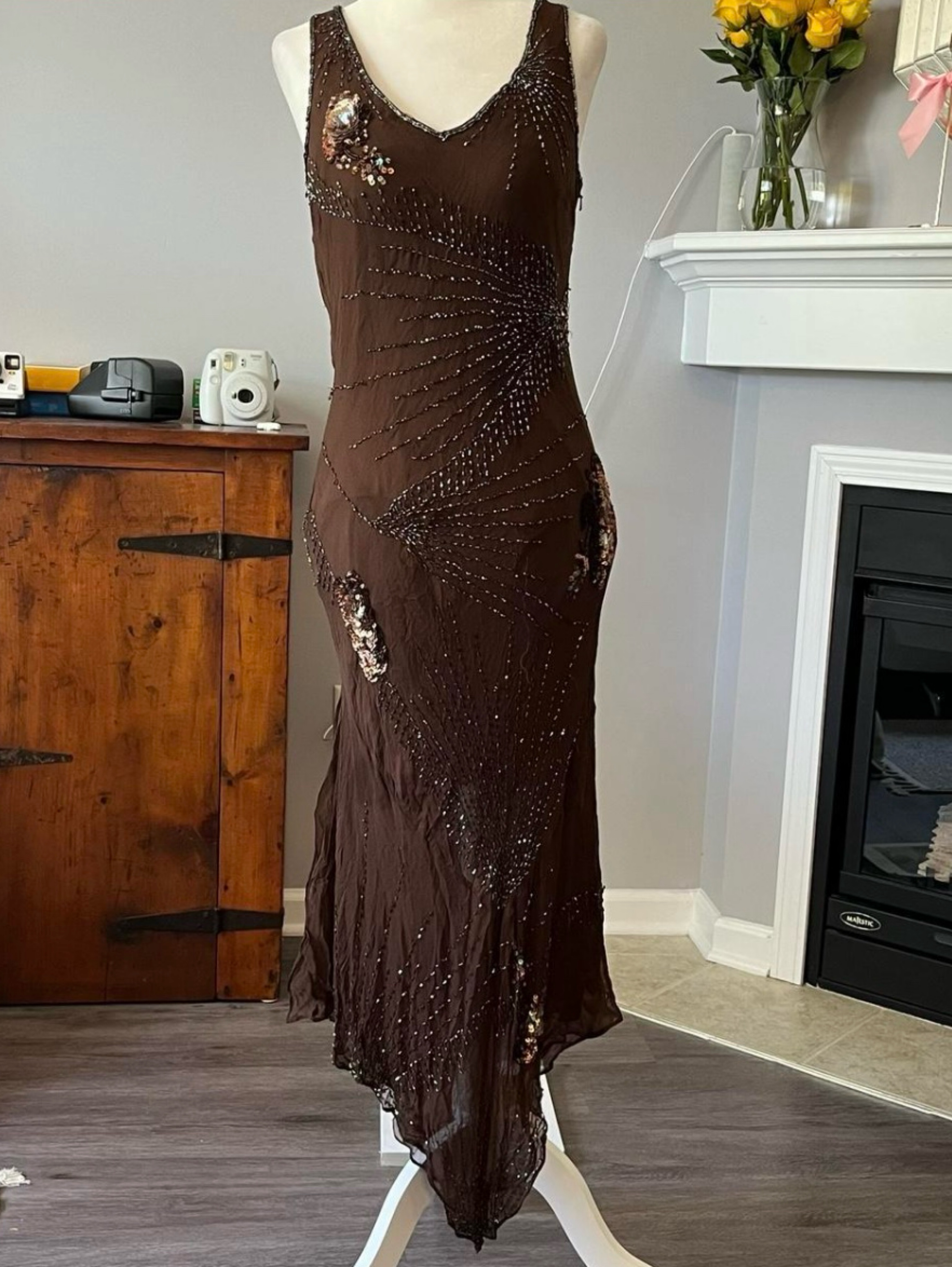 cache beaded dress The vintage 90s/Y2K cache beaded dress is a true masterpiece of fashion, combining elegance, asymmetry, and intricate beading details. The dress is made of delicate silk, which drapes beautifully on the body