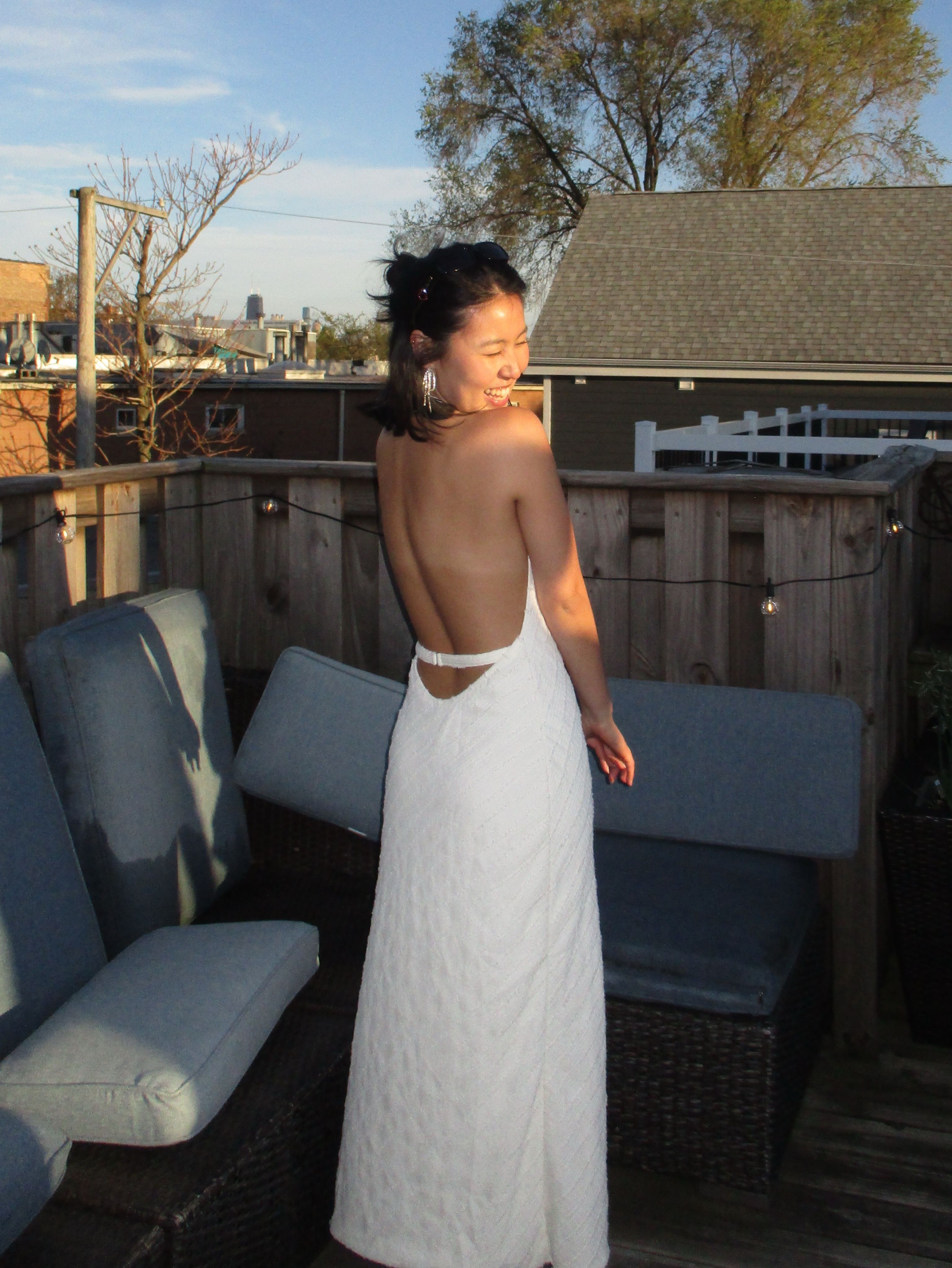 white backless midi dress Muse @sonyaesman wears the Aisle Pearl Satin Backless Midi Dress. The Backless Midi is a romantic design, complete with a high shine and luxe satin finish, adding elegance to