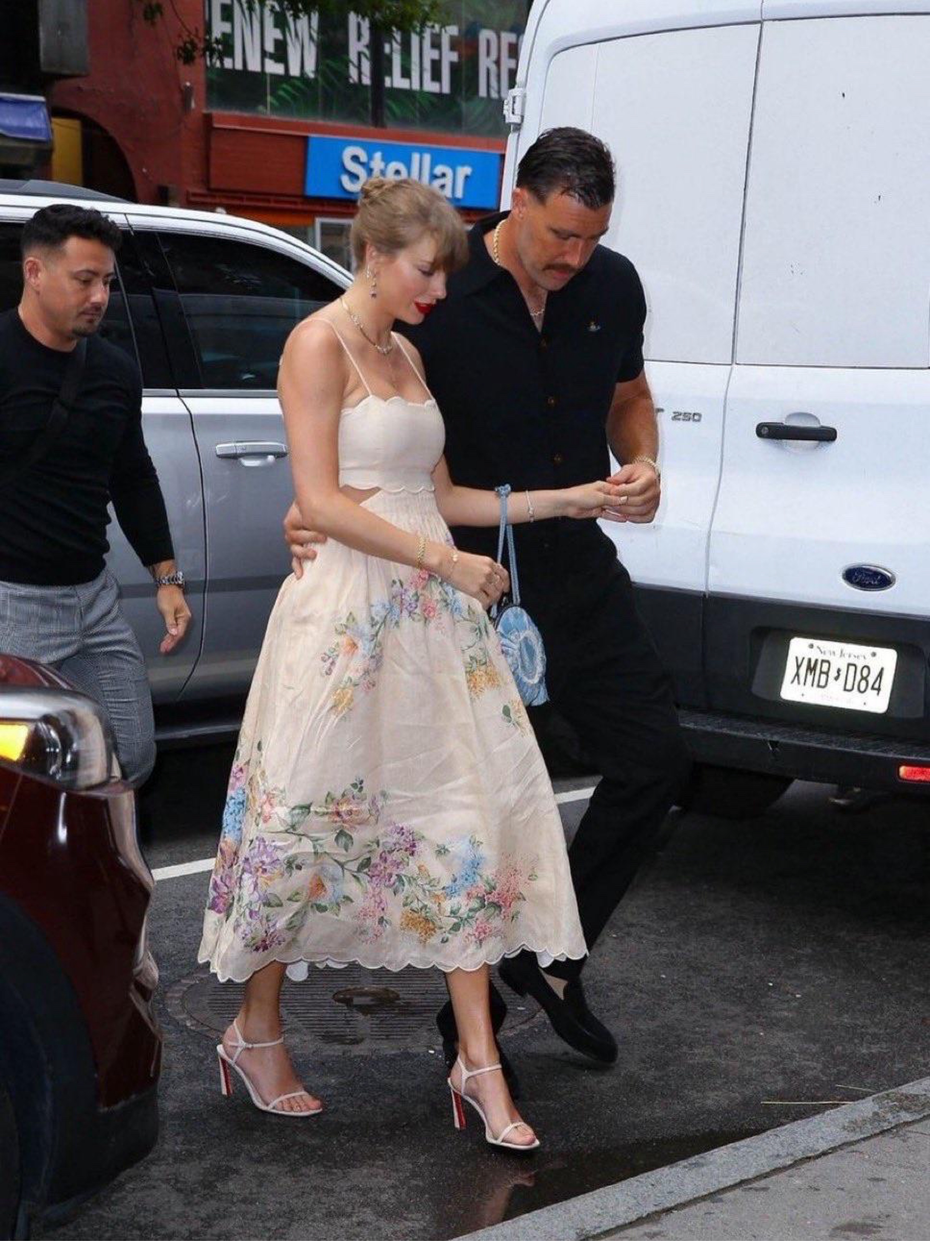taylor swift cream floral dress Taylor Swift Wears Dreamy Floral Cutout Dress With Travis Kelce
