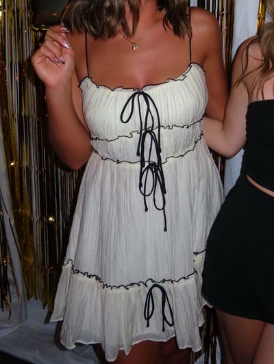 Cream Pleated Mini Dress with Black Tie Details by madida | Pickle