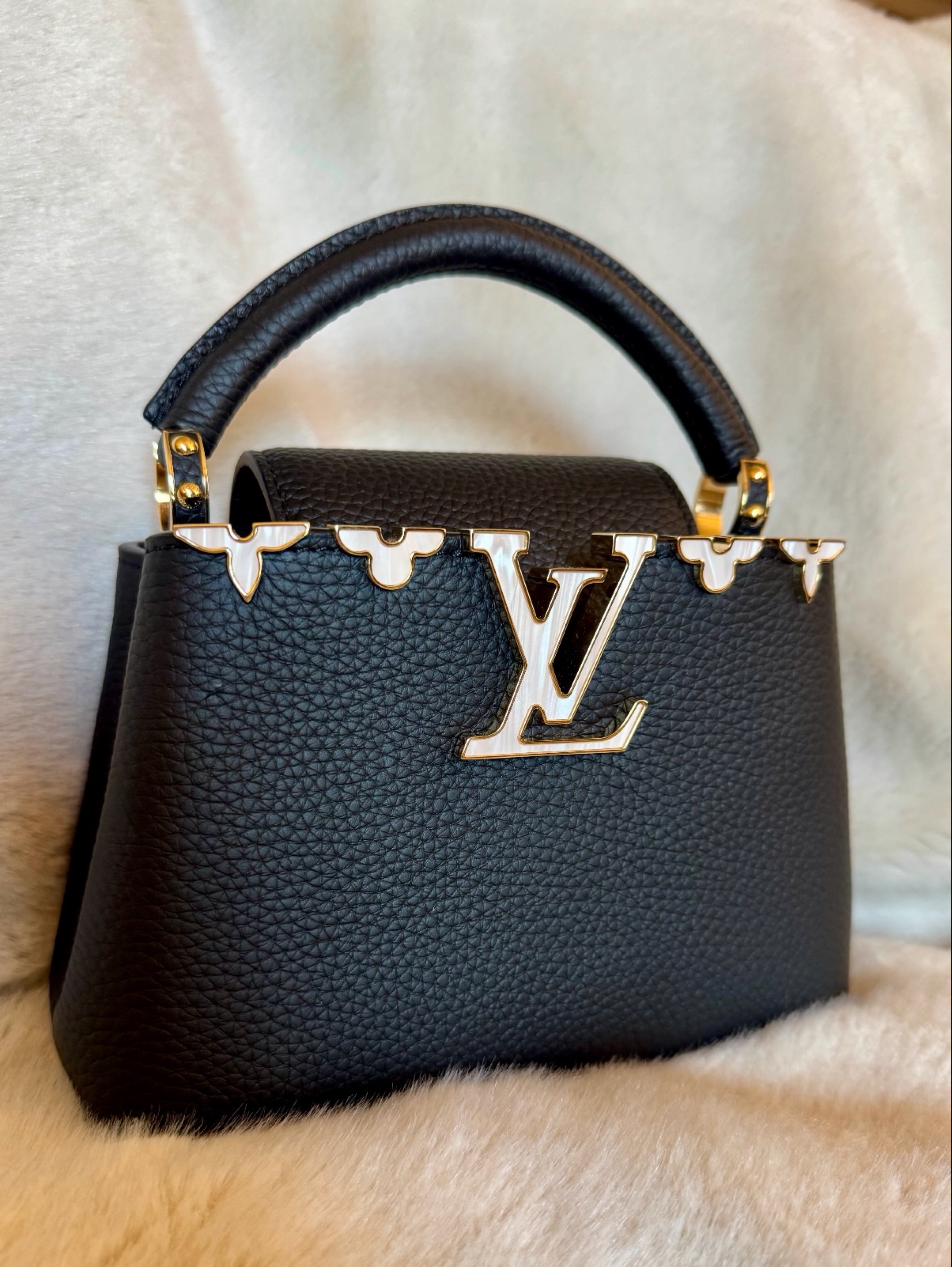Louis Vuitton Capucines Mini handbag w/ distinct gold-toned logo & mother-of-pearl effect flowers