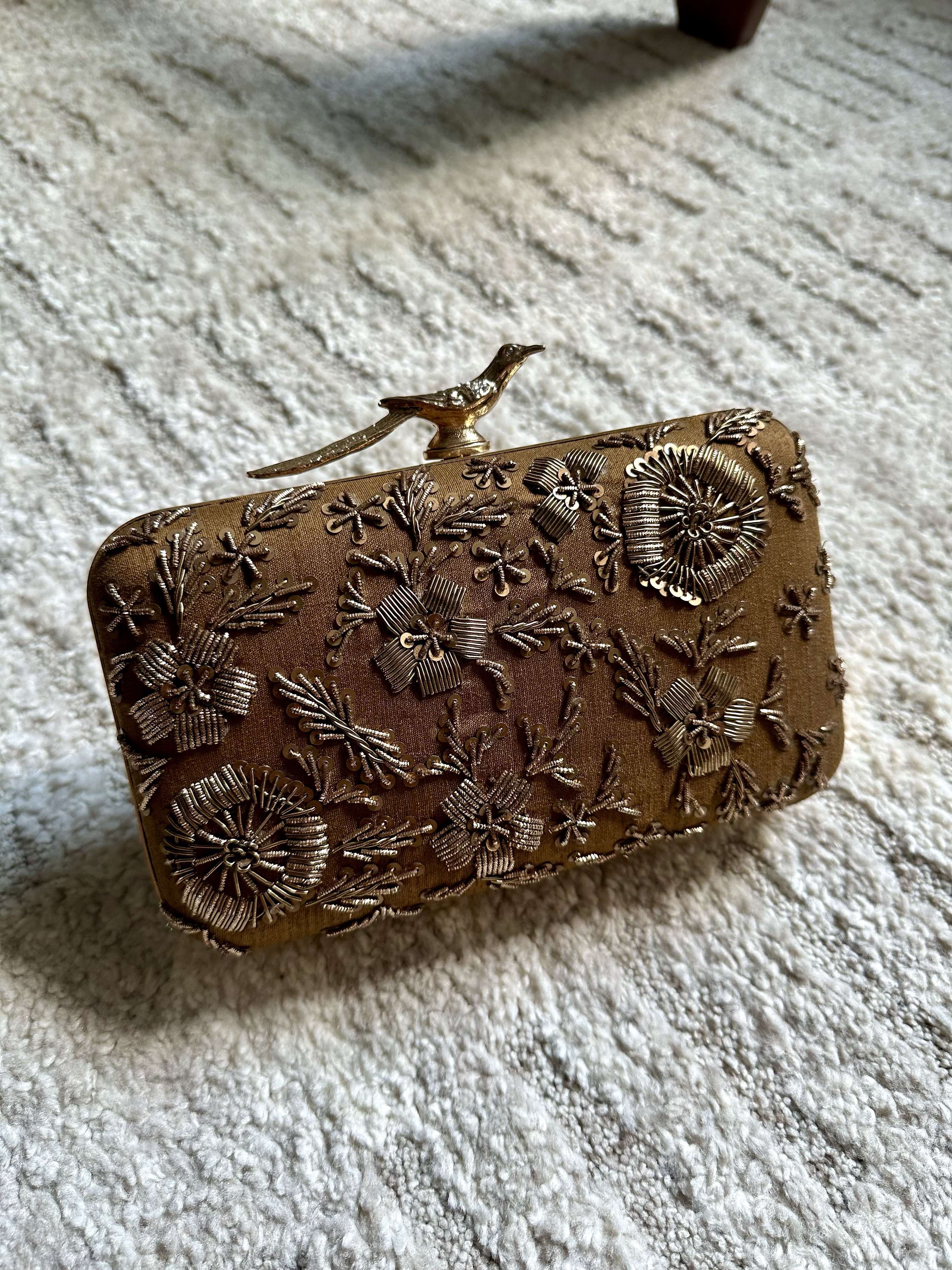 Embellished brown clutch
