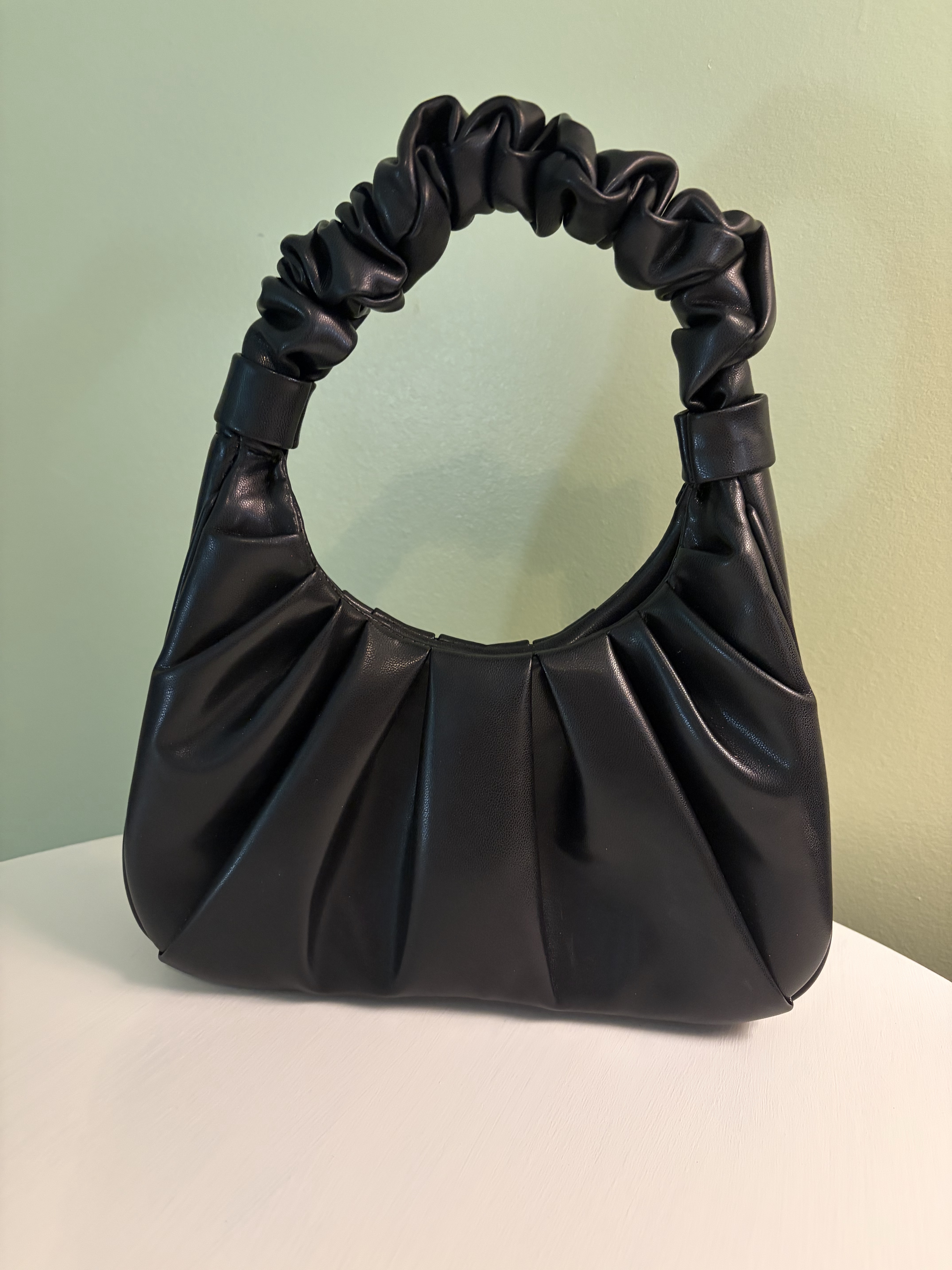Black faux leather hand bag