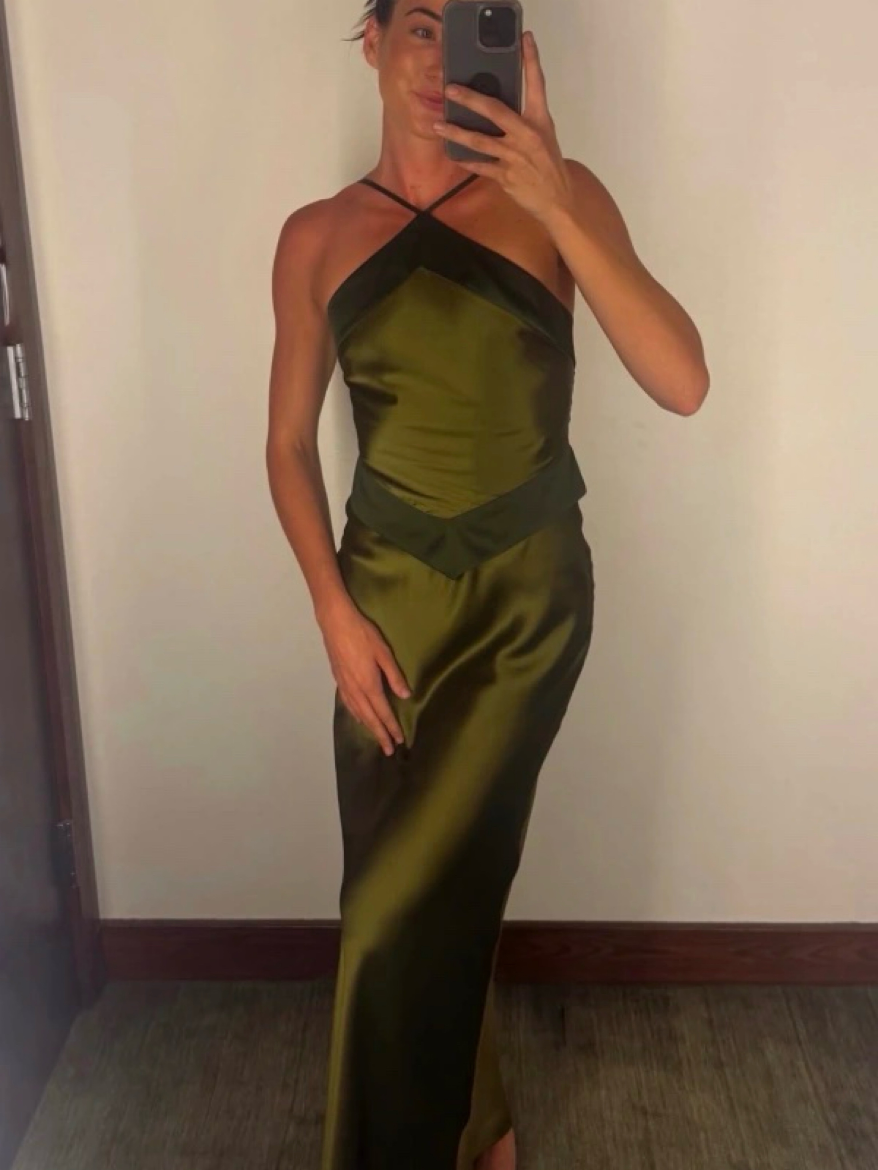 green halter wedding guest dress The perfect wedding guest dress- this olive green halter-neck silk low back dress is so flattering on a shorter, curvier body. The halter neckline pulls the eye upward which makes your neck
